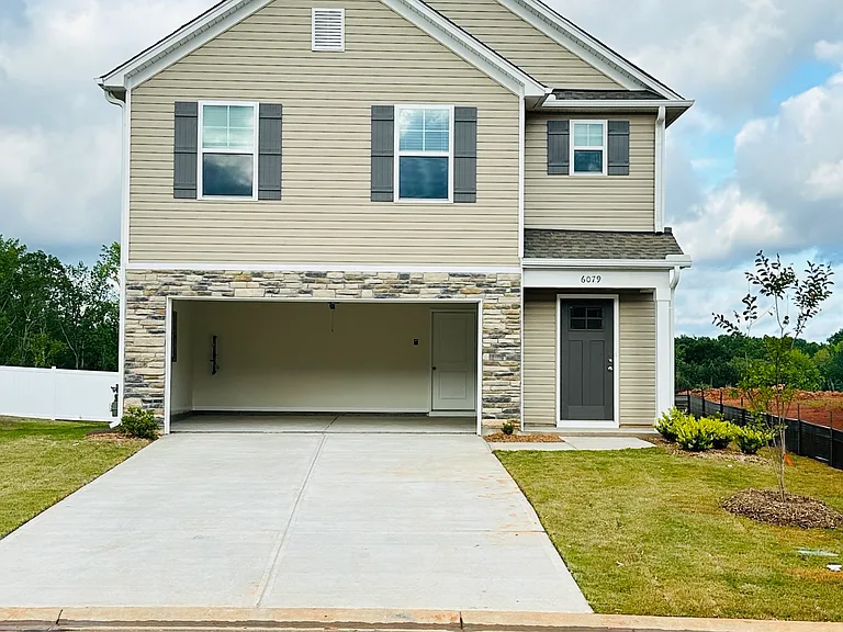 Stone Accents and large driveway
