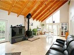 Kiving Room with Cathedral Open Beam Ceilings