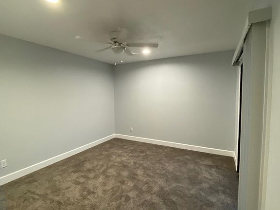 bedroom 2 with closet and balcony also