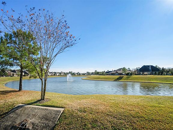 SERENITY AWAITS YOU! A backyard that is completely fenced and an awesome water view.