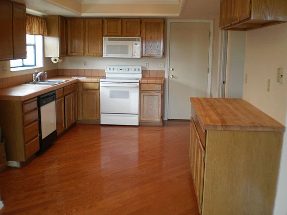 Oak cabinets and wood floors in the kitchen