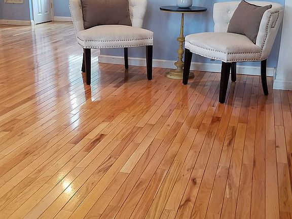 living room view opposite wall with the entrance foyer in the background