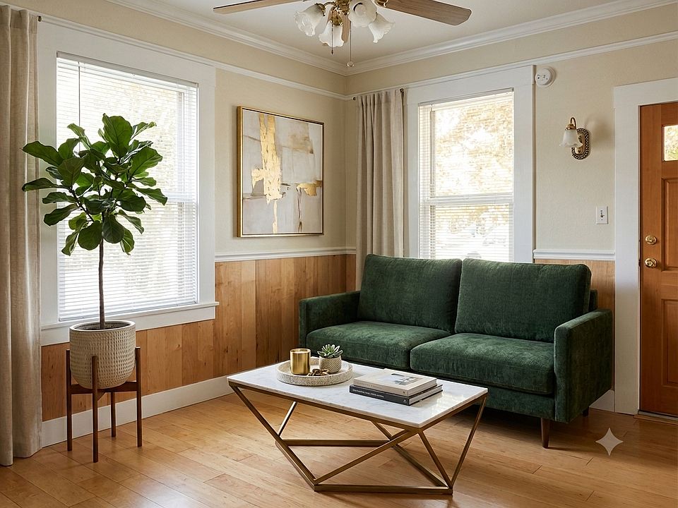 Living room, virtually staged, with ceiling fan, moulding and vintage fixtures.