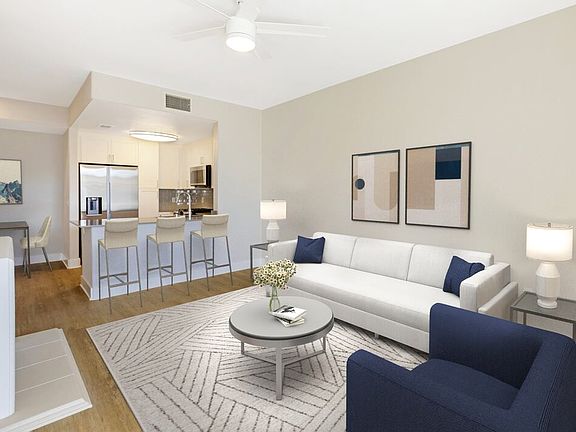 Renovated Package I living room with hard surface flooring