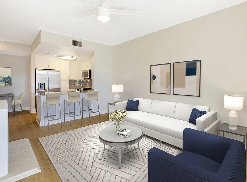 Renovated Package I living room with hard surface flooring