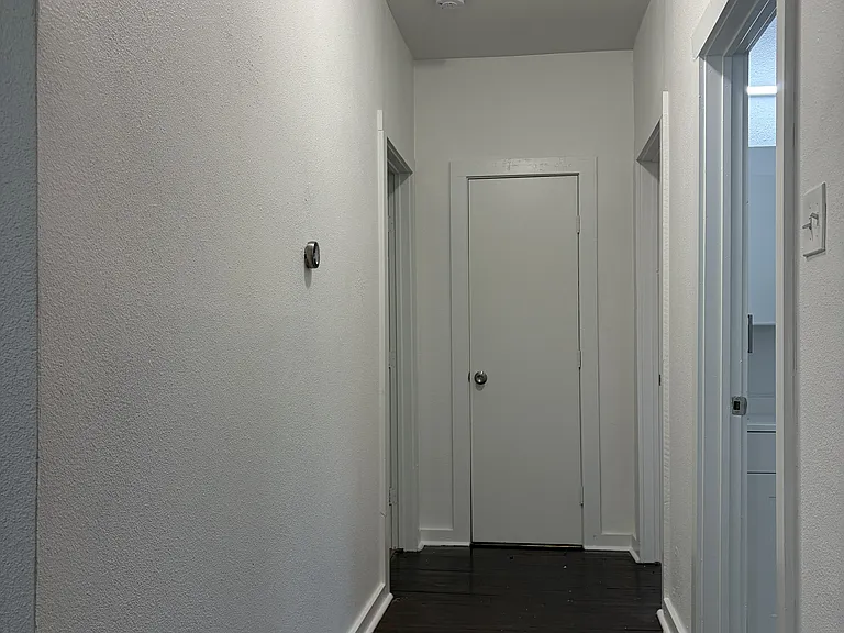 Hallway to hall bath, master bedroom and bedroom 2