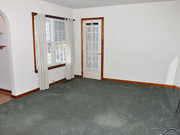 Living room with door to den