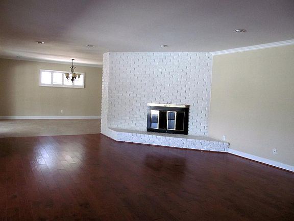 Large living room with wood burning FP