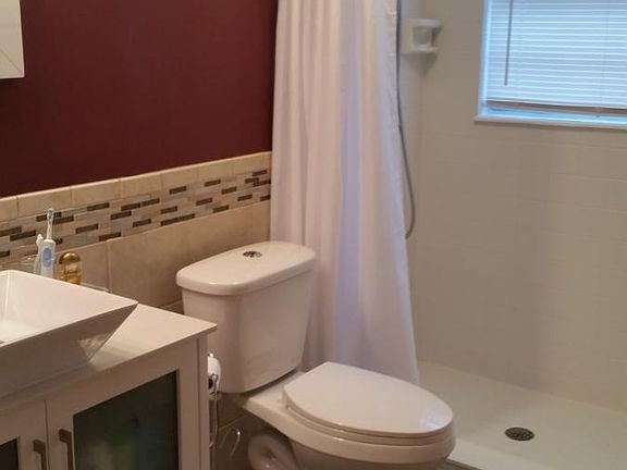 master bath with vessel sink and private shower, wood-look c