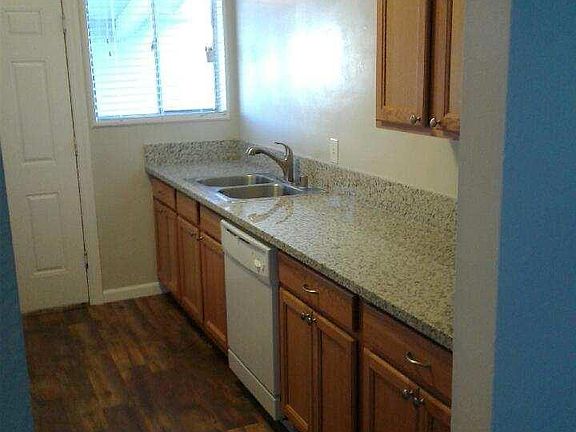 Kitchen has granite and a dishwasher