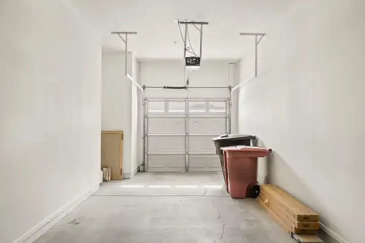 A long but narrow garage. SUVs may be a challenge to park... there is room for one SUV on the driveway.