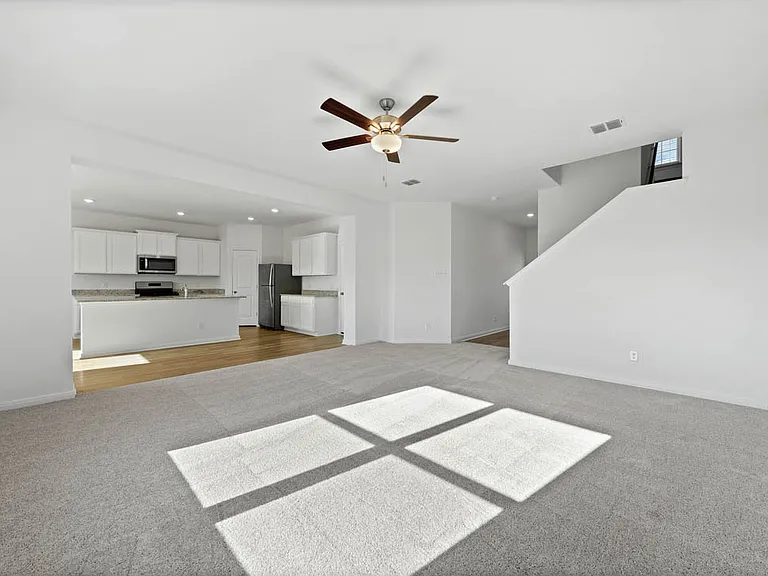 Spacious family room perfect for hosting.
