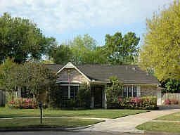A lovely cottage style home is located on a secluded cul-de-sac