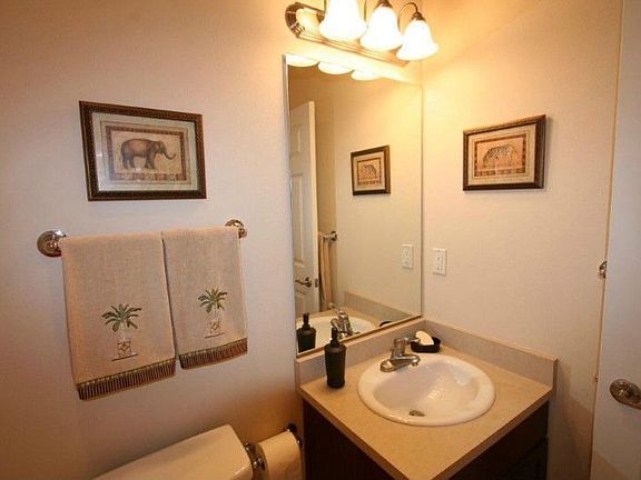 Another view of kitchen. Clothes closet and separate laundry closet shown.