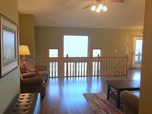 Living Room with hardwood floors and open floor plan.