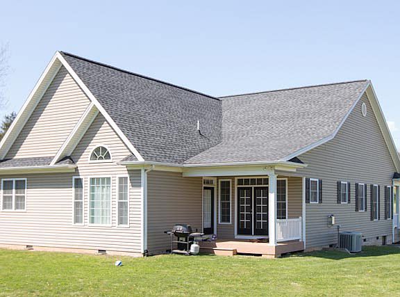 back covered porch with doors to master bedroom and living room