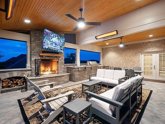 Incredible Outdoor Entertainment Covered Porch - Heaters & Remote Controlled Screens so you can enjoy this area year round!