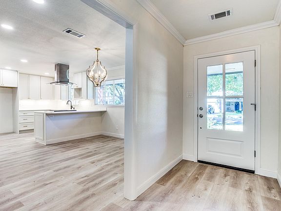 New wood laminate flooring throughout the home.