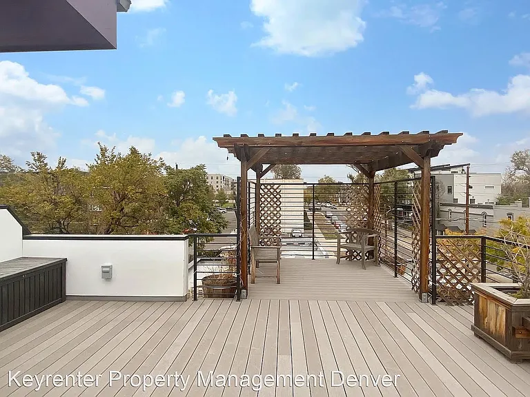 Sitting area on the roof deck. Pergola has been removed.