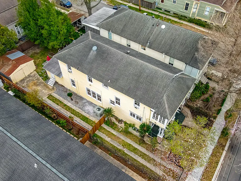 Aerial View; Driveway from road to rear of lot leading to detached garage. Lot is 120' deep. Plenty of room for parking off street and room for 1 vehicle in detatched garage (or plenty of storage room for personal belongings).