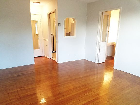 Living room facing kitchen, bedroom & hallway