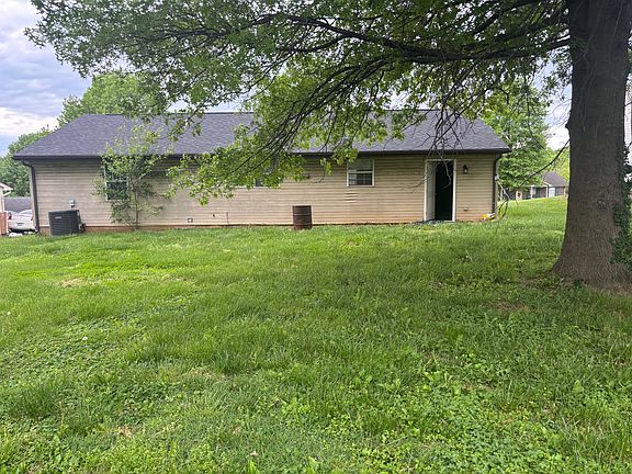 Back of house w/ fenced in back yard