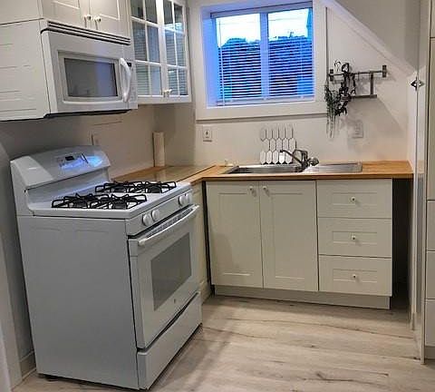 Kitchen with gas stove and microwave