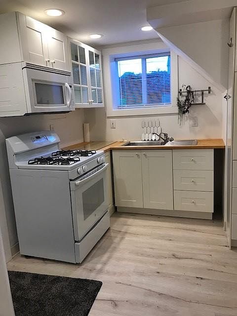 Kitchen with gas stove and microwave
