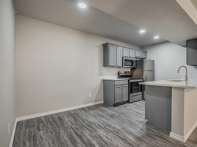 Explore this sleek kitchen, offering modern aesthetics with functional design.