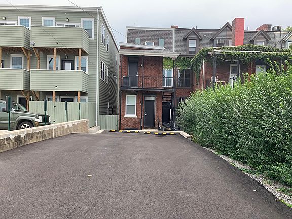 Parking spaces located in back of the building (Private entrances via the stairway on the side)