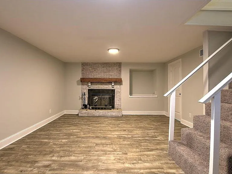 Downstairs spacious den.