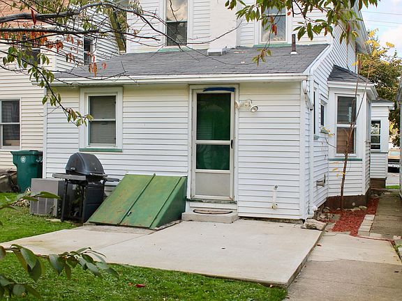 Entrance to Apartment with patio and Bilco doors to basement