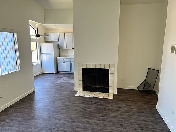 Living room with fire place looking into
Kitchen