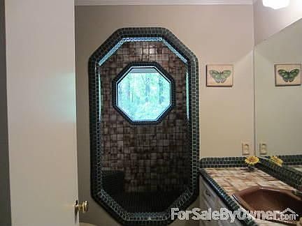 Guest bathroom
						:
						Unique tiled shower