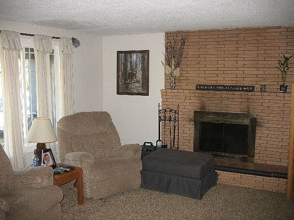 Wood Fireplace in Living Rm