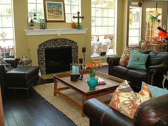 Greatroom - open to the kitchen and offering views of the pool. Handscraped wood flooring is throughout the downstairs.