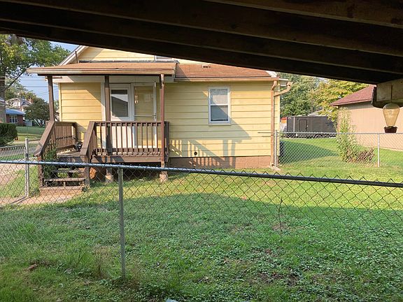 Back porch, partially fenced back yard