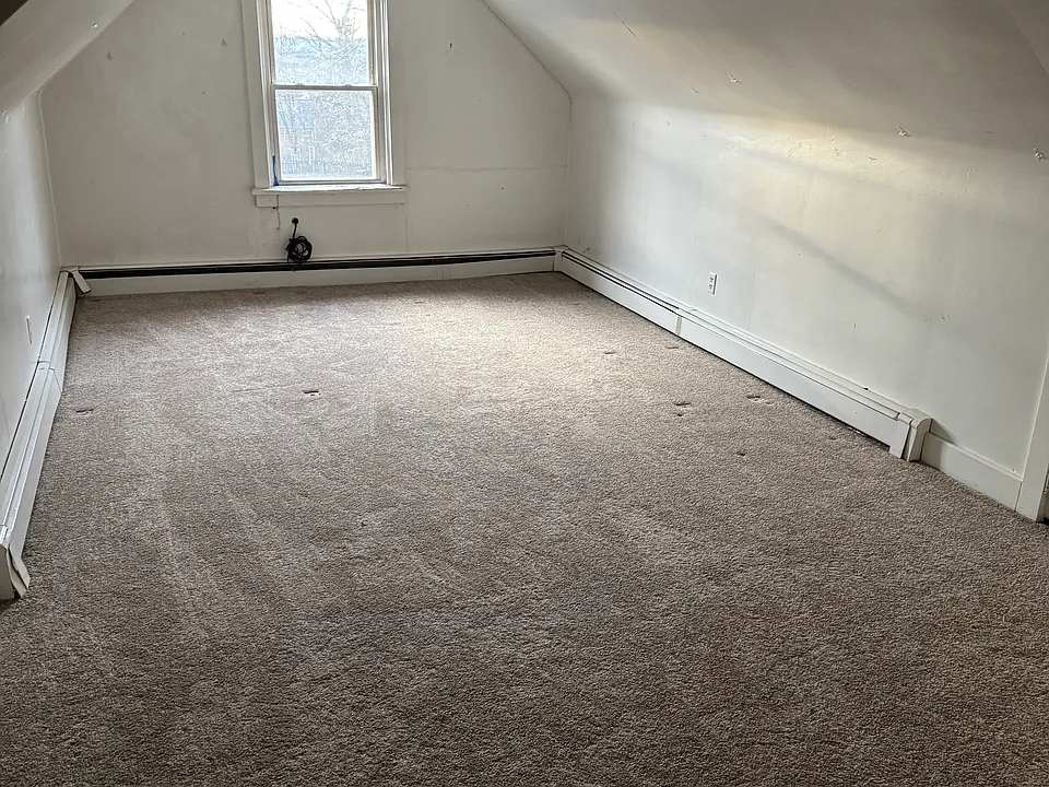 Oversized rooom with new carpet. Can be used as another bedroom or large office or living space.