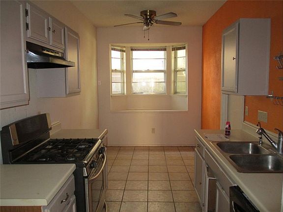 Kitchen with adjacent breakfast room.