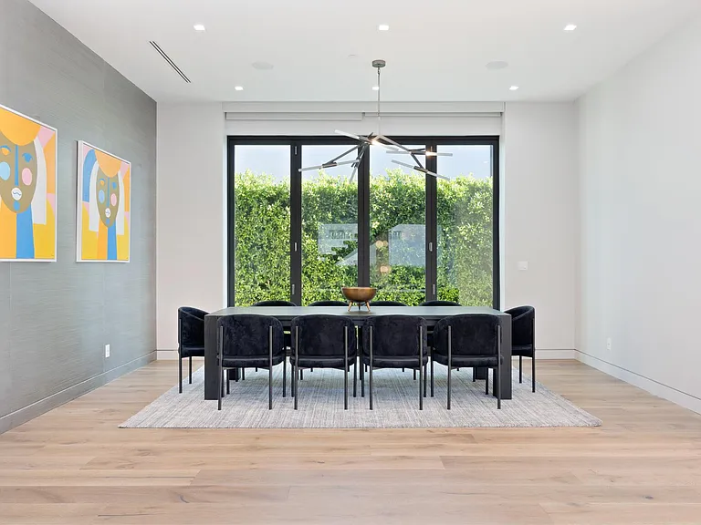 Enjoy a delicious meal at the 10-person dining table
Open and elegant dining room with modern art