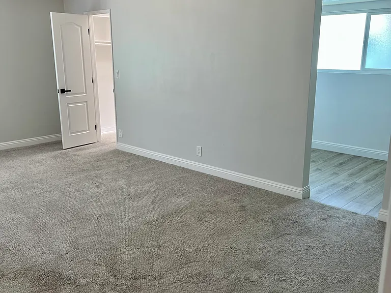 Main bedroom with remodeled large ensuite bathroom and walk in closet