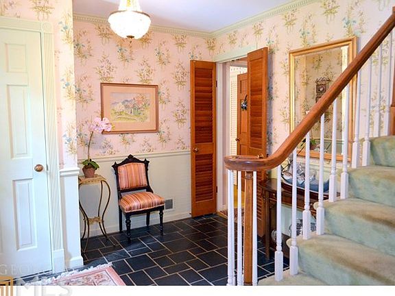 Foyer entry with well maintained slate floor