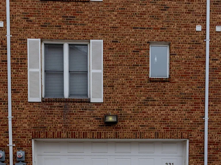 Back exterior - 2 parking passes for off-street parking in addition to 2-car garage