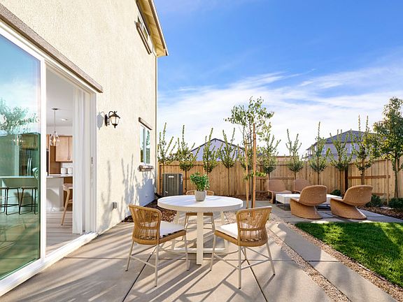 Back patio offering indoor outdoor living