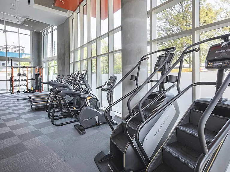 24/7 fitness center with cardio and strength training equipment
