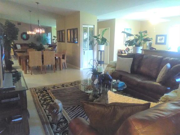 LIVING AREA LOOKING TOWARDS THE FOYER/FRONT DOOR