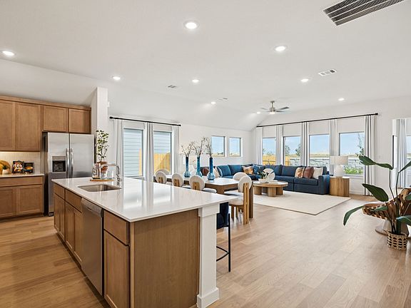 Kitchen in the Diamond home plan by Trophy Signature Homes - REPRESENTATIVE PHOTO