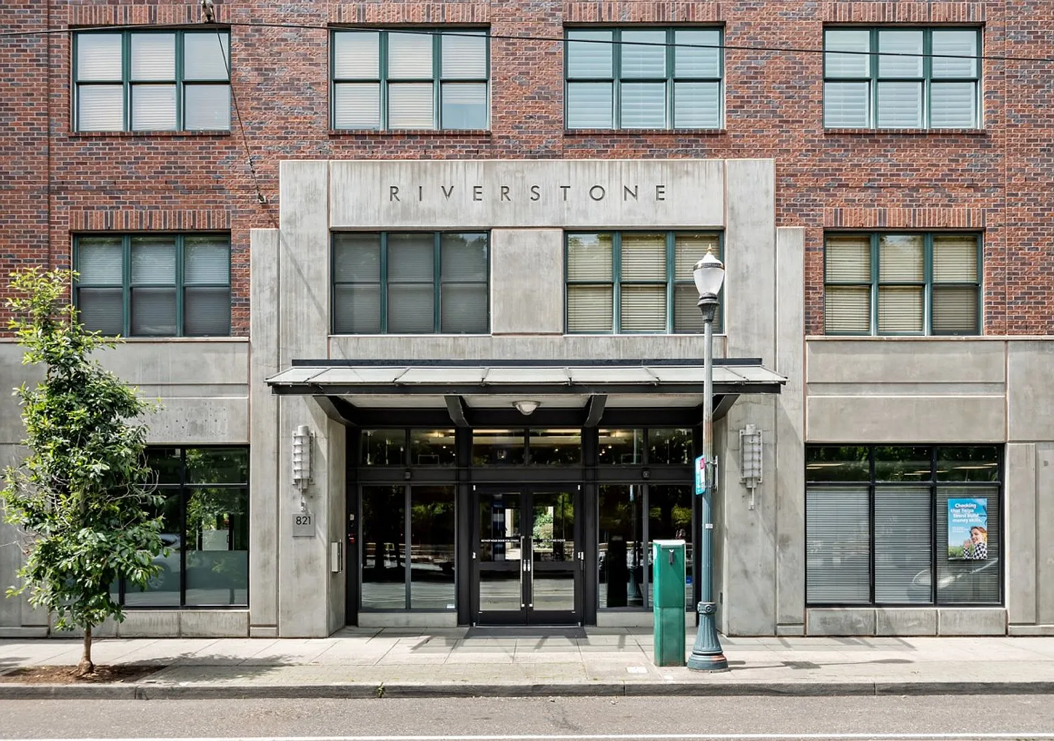 Ground-Floor Corner 2BR + Den at Riverstone Private Courtyard Entrance & Terrace (Pearl District) — Photo 1