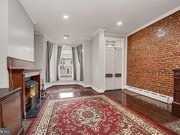 Welcome. Large Ballroom DR with walk-in bay window, exposed brick with FP