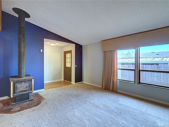 This home features a great room with a wood burning stove for alternate heating, vaulted ceiling and a large picture window.